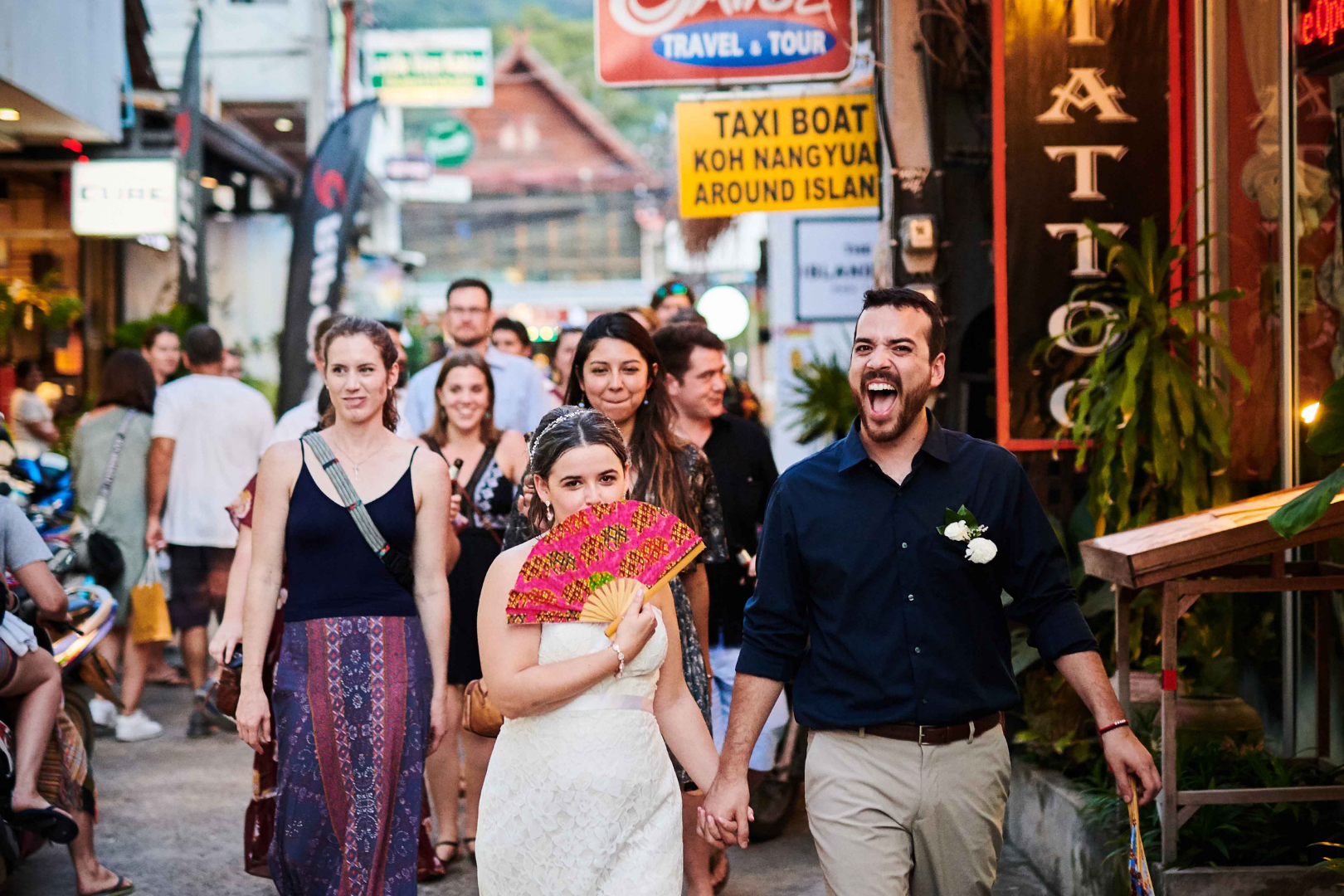A wedding on Koh Tao with the bride and groom walking through the streets